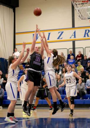 Jamie Waldron (#12) scored 13 points for the Crusaders.