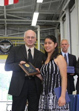 Brenda Velez received the Outstanding Culinary Careers Academy Award. She is pictured with OU BOCES Cooperative Board member Michael Bello.