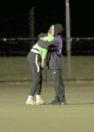 Crusader Assistant Coach Elise Fugowski consoles a broken-hearted Olivia Shippee after a season ending loss.