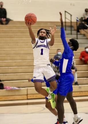 Tyace Thompson ,#1, led the Crusaders offense with 10 points against the Middies.