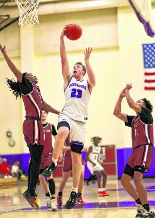 Kyle McDermott, #23, crashes through the Tigers’ defense.