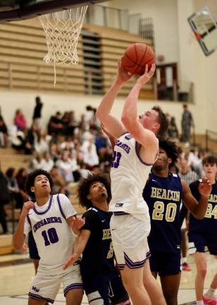 Kyle McDermott, #23, has shown some strong play on the boards, a big reason for the Crusaders’ success this year.