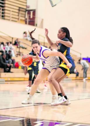 Sienna Feeley, #14, struggles to get past a Bushmen defender late in the game.