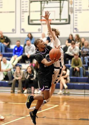 Trayvon McGraw, #21, led the Crusaders to victory with eight points in the fourth quarter.