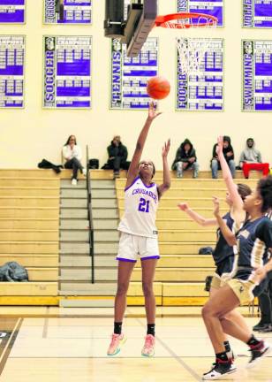 Senior Zoe Hudson, #21, gets off a short jump shot in the first quarter.