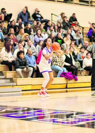 Freshman,Brianna Taveras, #24, lines up a three point shot in the second half.