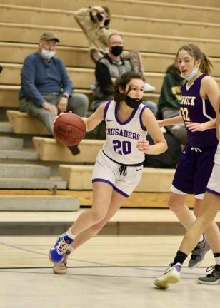 Faith Welsh #20, swings past a Wildcat defender late in the game.