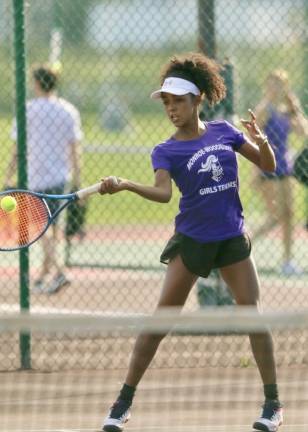 Amaya Grant returns a serve in her victory in second singles.