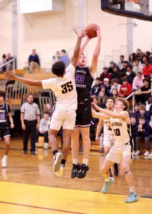 Senior Kyle McDermott, #23, helped the Crusaders control the boards.