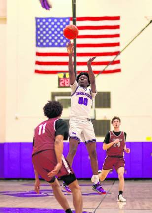 Fabrice Ndja, #00, led the Crusaders with 17 points in the game.