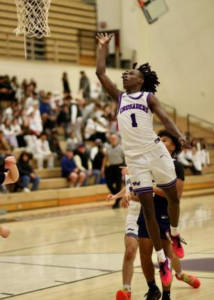 Jayden Desir, #1, uses his speed to beat a Bulldog defender to the basket.