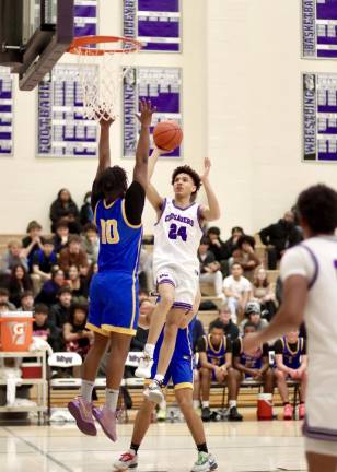 CJ Pearson, #24, floats down the lane in the first half.