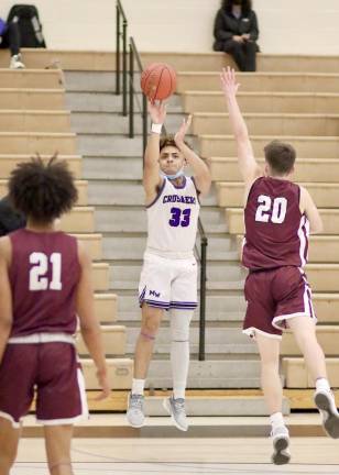 Samuel Fileen, #33, hits a 3-point shot in the 4th quarter