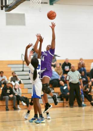 Layla Green explodes past her defender. She scored 14 in the Crusader victory.