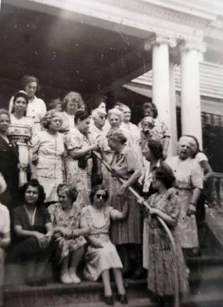Timothy Mitts' research shows that Helen Keller was keenly involved Rest-Haven Inc., which operated as an adult home residence home from 1923 to 1968 at 236 High St. in the Village of Monroe. Keller can be seen in the center of this 1950 photo (she's turned to the left, holding the rail) on the steps to Rest-Haven with about 20 other blind women who were vacationing there. Mitts said the photo &quot;starts to show that Helen was more involved in the operations of Rest-Haven than previously known to the public. There is a letter in 1945 or so that speaks of this that will be released later.&quot;