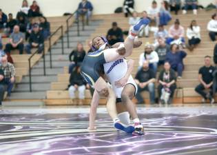 Crusader Marcus Charlot records a take down in his 145 lb match.