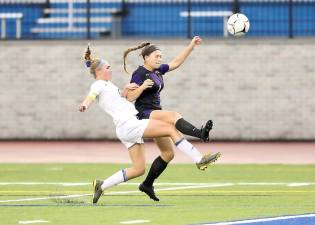 Photos by William Dimmit Kaelyn Salatto battles with a Viking defender in the first half.