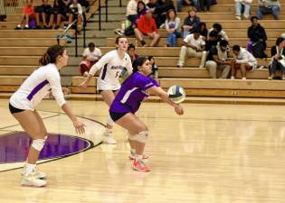 Abby Ohren, #14, returns a holdback serve.