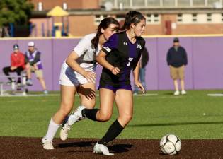 Francesca Donovan, #7, weaves her way past a holdback defender.