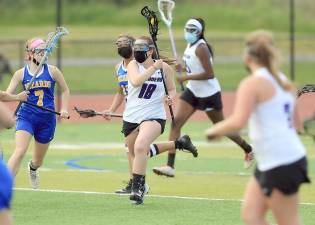 Maeve Ryan brings the ball right through the middle of the Wizards defense. Photos by William Dimmit.