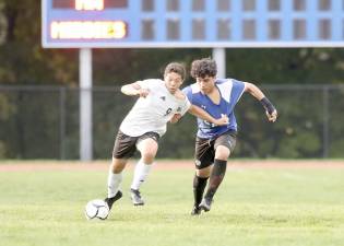 Crusader Neptaly Castro, #9, battles his way past a Middletown defender.