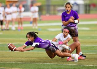 Kaitlyn Aybar dives into the end Zone to give the Crusaders a 19-7 lead in the third quarter.