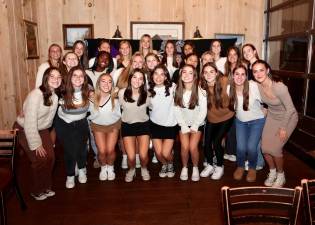 Members of the school district’s varsity and junior varsity girls’ soccer teams.