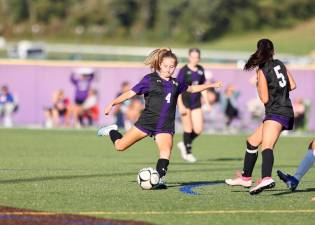 Crusader Anna Llewellyn (#4) gets off a shot in the first half.