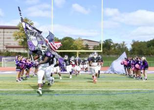 The Crusaders storm onto the field on Saturday afternoon.