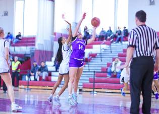 Sienna Feeley, #14, kept the Crusaders close in the first half.