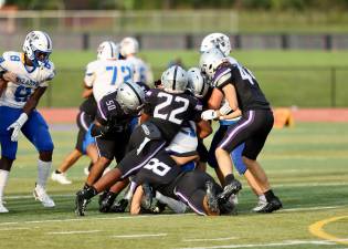 The Crusaders defense swarms over a Wizard ball carrier.