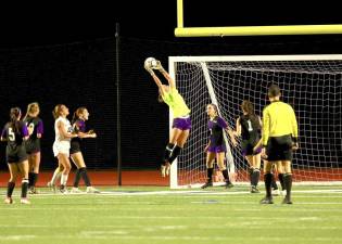 Crusader Goalie Reese Dolan makes a leaping save to keep the Bushmen off the board.