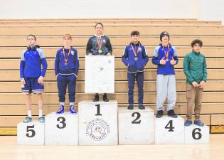 Gail “Gigi” Sullivan makes history with here first place finish at 101 lbs.
