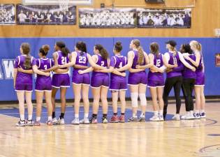 The Crusaders line up for the National Anthem before their first game of the season.