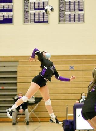 Jordan Ader (#15) gets ready to smash the ball into the Middies zone.