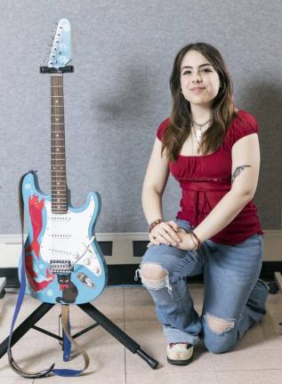 Warwick Valley High School senior Taylor Lipnicky with the guitar she created for the Virtual Chair Auction, starts on May 12. Photos by Tom Bushey/WVSD.
