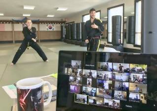 United Martial Arts Center will be offering two weeks free virtual online training starting next week. Pictured here are Master Jason Bender and Instructor Alex Prisco.