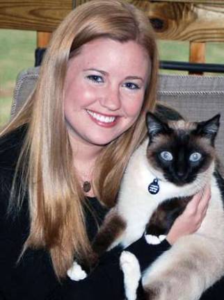 Monroe native Kaylin Ruffino with her Siamese cat, Jackson.