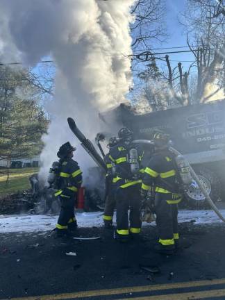 Dump truck ignites after crash with SUV