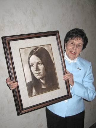 Julia Quinlan holds a photo of her daughter Karen Ann, who died in 1985. (Photo provided)