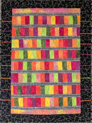 During November, the Monroe Free Library is featuring the artwork of quiltmaker Eda Steinman, a designer known for her use of color and the graphic qualities of her work.