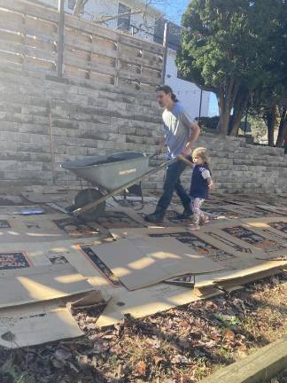 Tony Cornelius and his daughter doing yard work at their house in the Village of Warwick. He had assumed they would get chickens when they moved up from Queens.