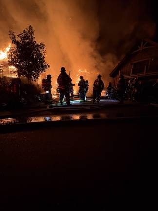 Firefighters battle massive house fire on Rock Ridge Road in Chester on the evening of Tuesday, Aug. 25.