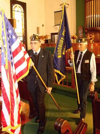 The colors are retired by Post 779 Color Guard and veterans Ralph Caruso and Don Blair.