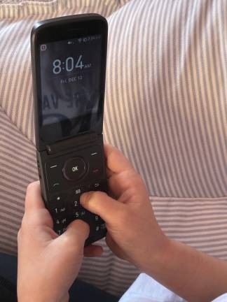 Some parents are opting to give their kids flip phones, which have been seeing a resurgence over the past few years.