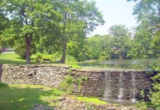 Smith’s Mill dam in the heart of the Village of Monroe Historic District. (Photo source: Wikipedia.)