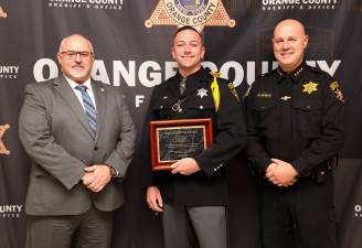 Division of Criminal Justice Services Deputy Commissioner Michael Bonse, Deputy Joseph Carey, and Sheriff Paul Arteta.