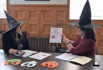 Ellen Beadle of South Orange Family YMCA and Monroe Village Trustee Dory Houle are good witches with cell phones and plans for Halloween: A Orange County Youth Bureau grant designed to provide family nights/events for children aged 3 to 14 is helping the South Orange Family YMCA, Smith Clove Park and the Village of Monroe to partner and host a Halloween event on Sunday, Oct. 31, from 12 to 2 p.m.