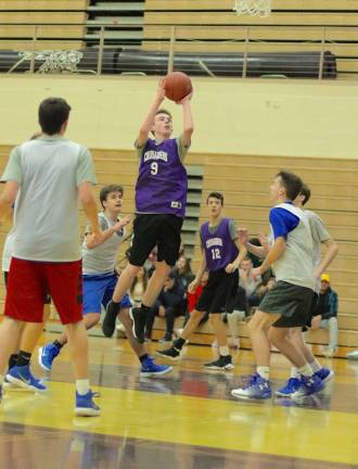 Connor Coffey (#9) stops and pops a shot in the lane.
