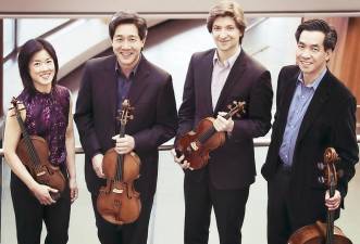 The Ying Quartet. Pictured from left to right are: Janet Ying (violin), Phillip Ying (viola), first violinist Robin Scott, and David Ying (cello). Photo by J. Adam Fenster / University of Rochester.